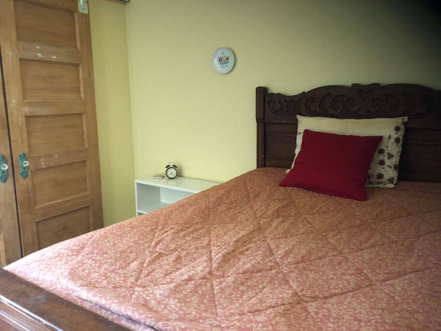 Double bed, closet space, and desk