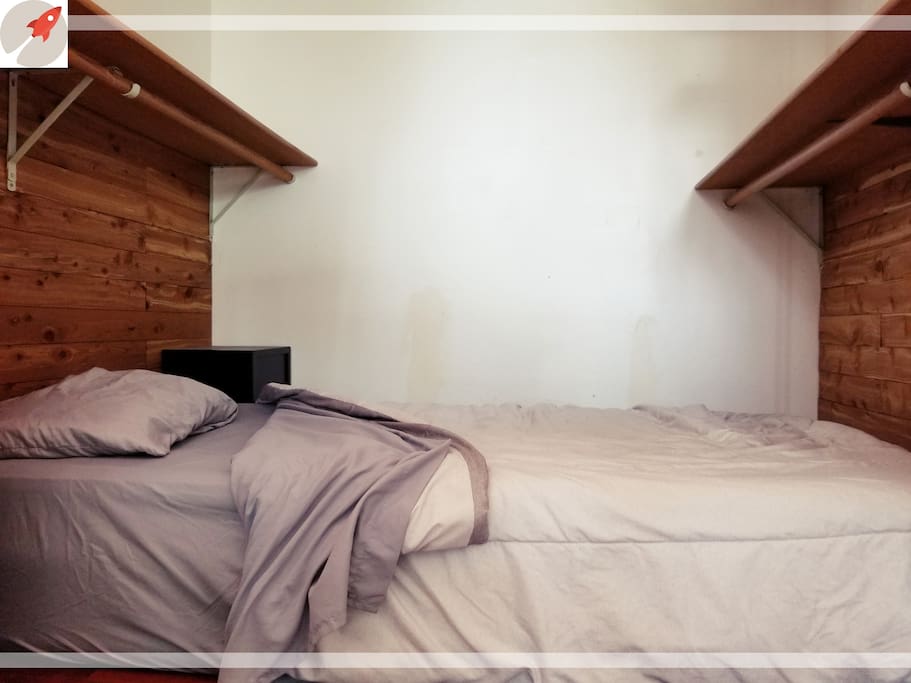 Your reservation comes with single bed tucked away into what was previously a walk-in closet with cedar lined walls. It has more privacy than the rest of the beds in this shared room.