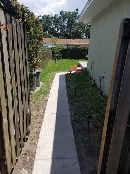 Private Lighted walkway and 2 steps to outside porch