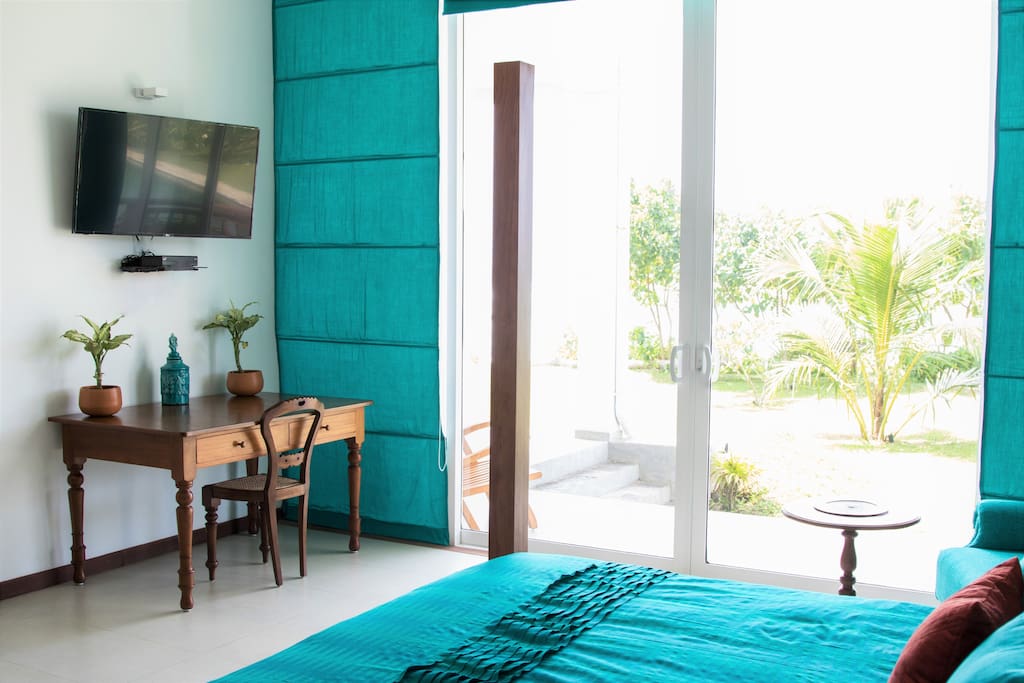 Ocean suite with large vista windows looking out at the beach at Parrotfish Bay, Sri Lanka