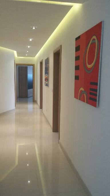 designer finish corridor leading to bedrooms and bathroom.