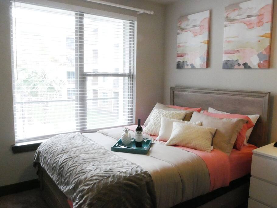 Cozy queen sized bed with luxury linens