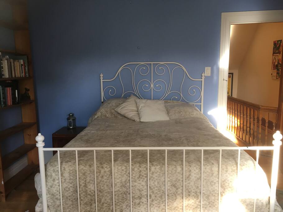 This cosy attic room has a wrought iron bed with a new, very comfy mattress