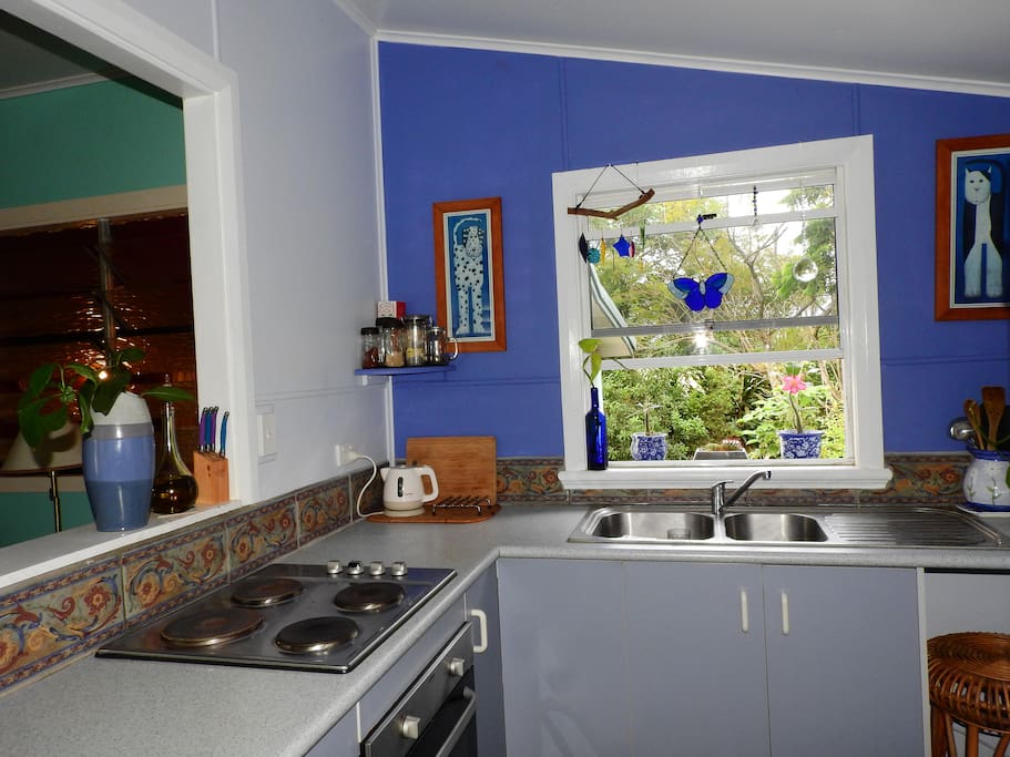 The kitchen with its very own window garden! The fridge has an ice dispenser for those hot sunshiny days!