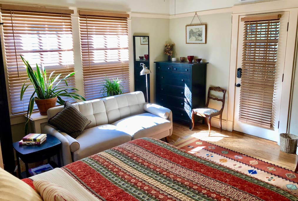 Plenty of light with two double hung windows and a french door leading to the shared backyard patio.