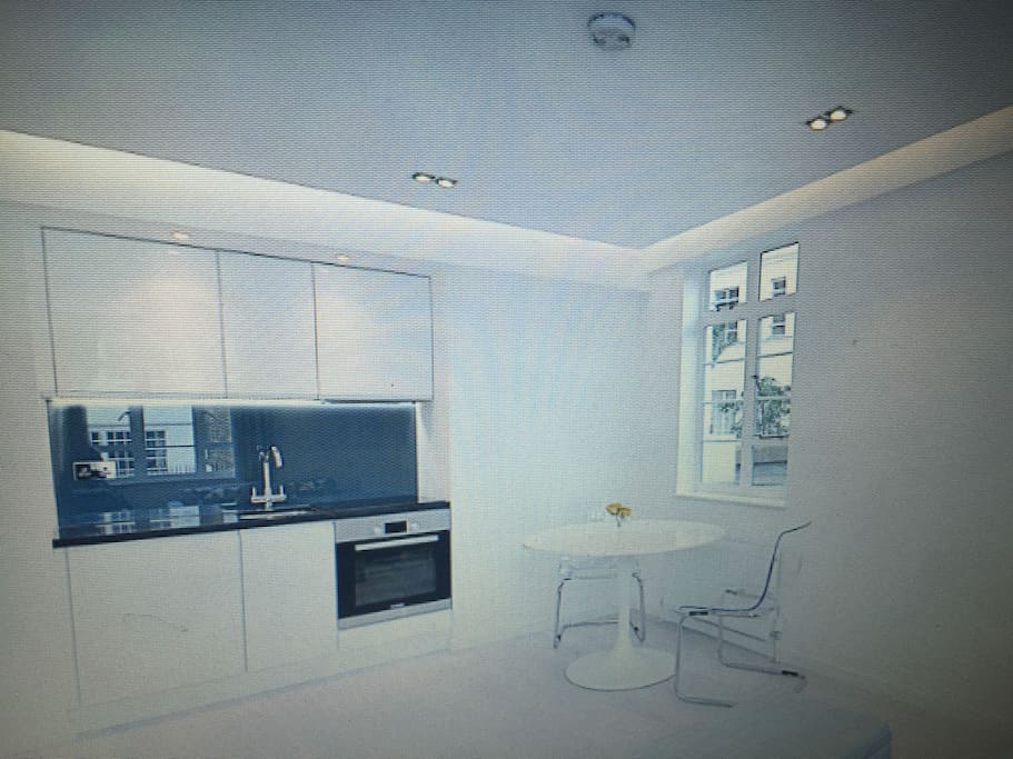 beautiful kitchen with washer dryer and electric hob