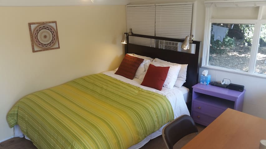 Private backyard room. Queen bed.