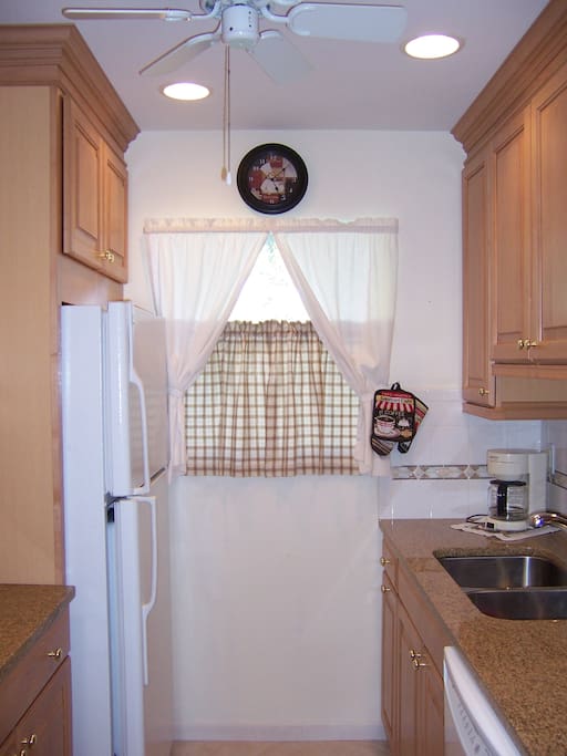 Kitchen updated 2008. Maple cabinets with pullouts, tile foor, high hat lighting fully equipped.