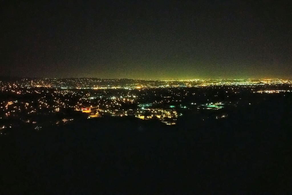 View at night from private patio. On clear days you can see all the way to the ocean and Catalina Island. Truly an amazing view at any time of the year.