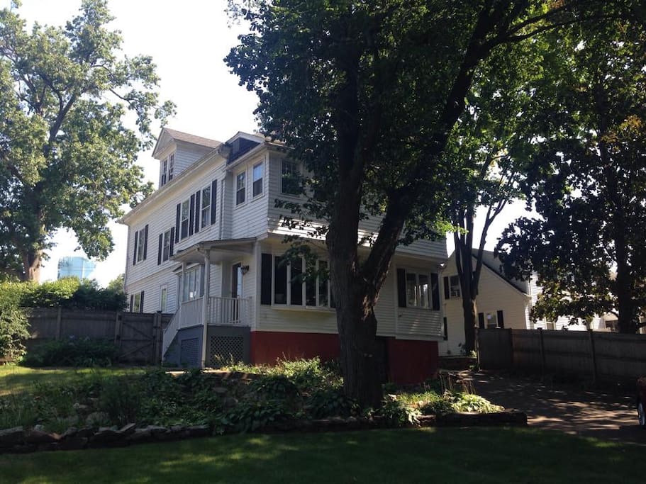 Back of house, fenced in yard and sitting area.