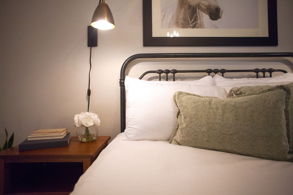 A warm and inviting queen bed awaits