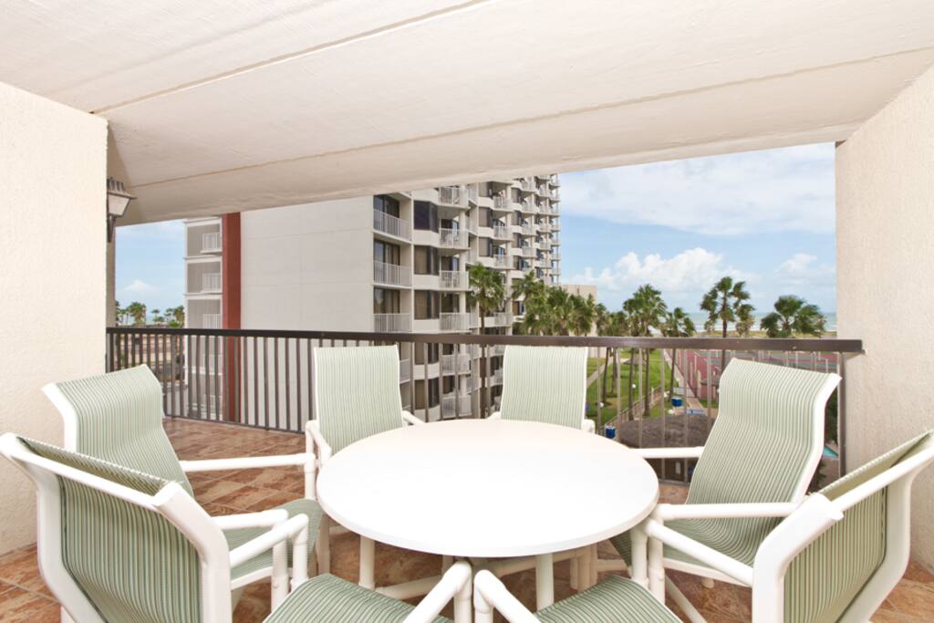 Patio dining set on our private pool and beach view balcony