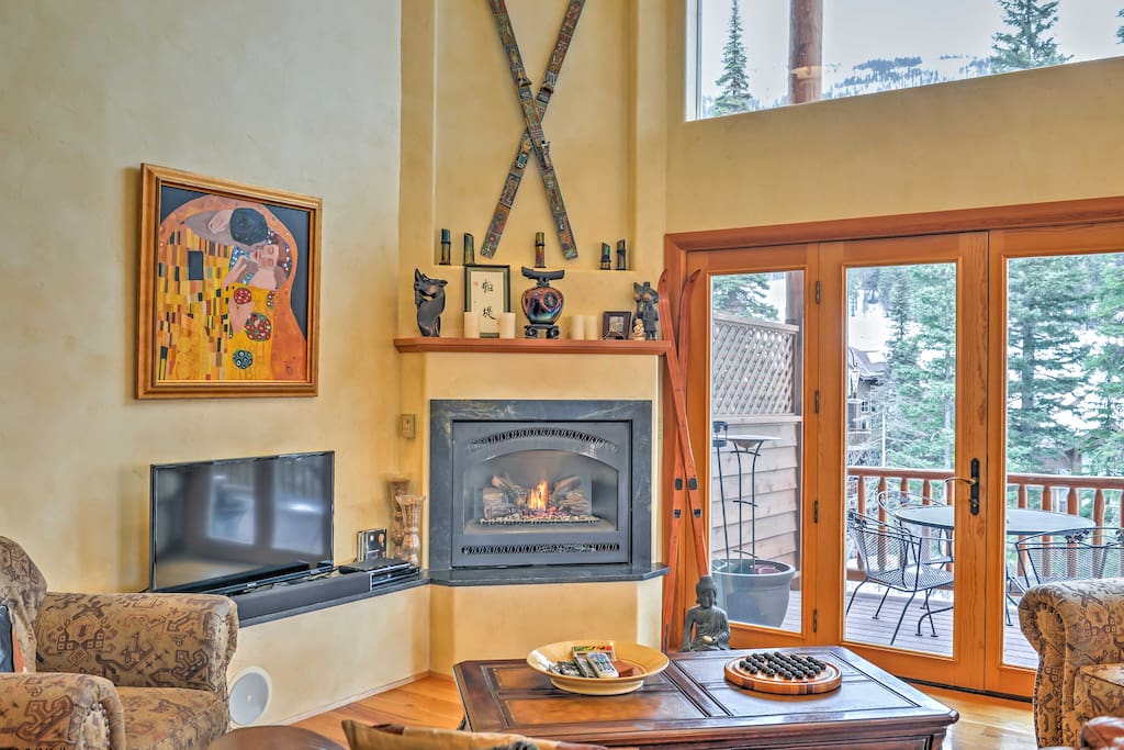 Lounge in front of the gas fireplace while watching TV in the main living room.