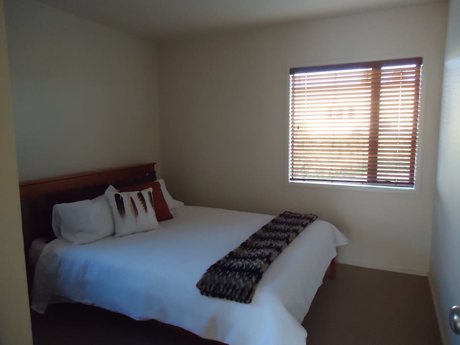 Bedroom 2 with queen bed draws mirror and wardrobe