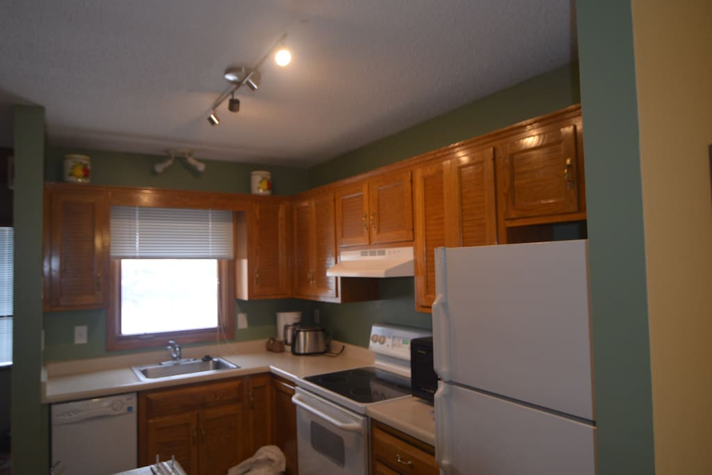 Kitchen, stocked with essentials, cooking utensils, and coffee provided