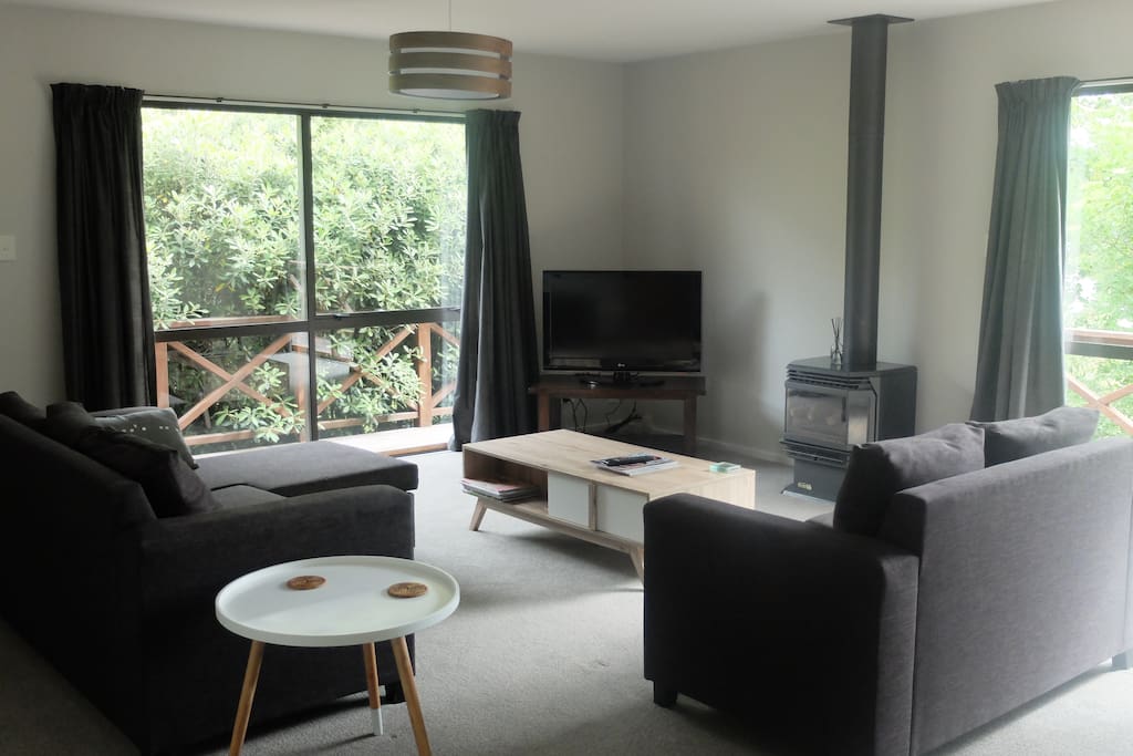 Warm cosy lounge with doors out to the balcony