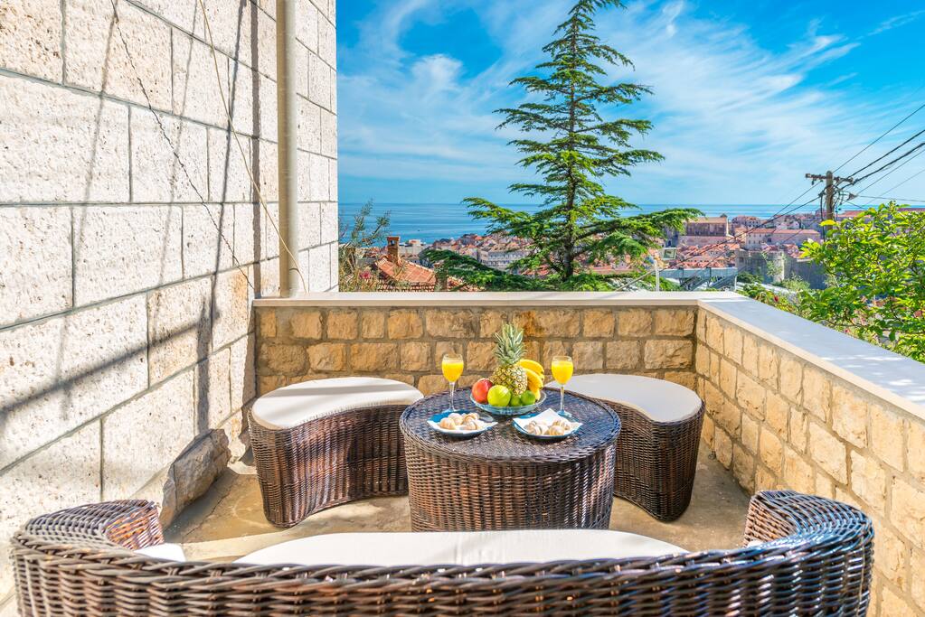 Welcome to Villa Magnolia, in this two-bedroom apartment our guests can relax on spacious terrace sourrounded with mediterranean garden equipped with dining table and lounge furniture boosting spectacular sea view over Adriatic Sea, Lokrum Island and UNESCO protected Dubrovnik Old Town.
