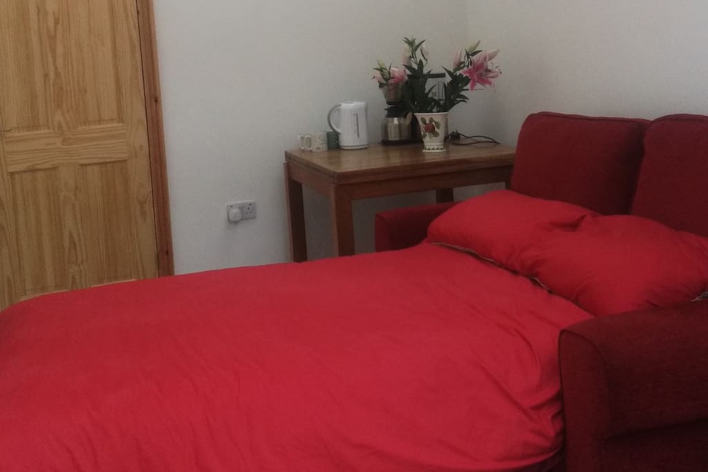 Comfortable bed settee with all bedding provided
