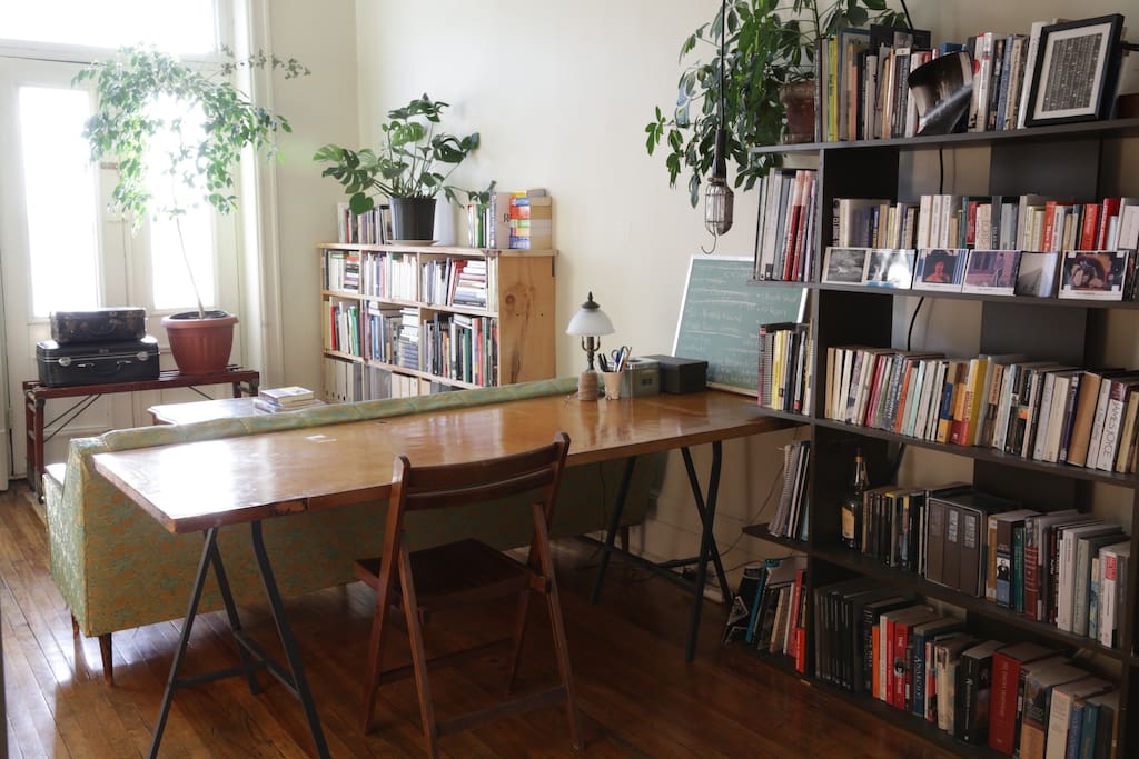 Living room/study with French doors onto front balcony.
