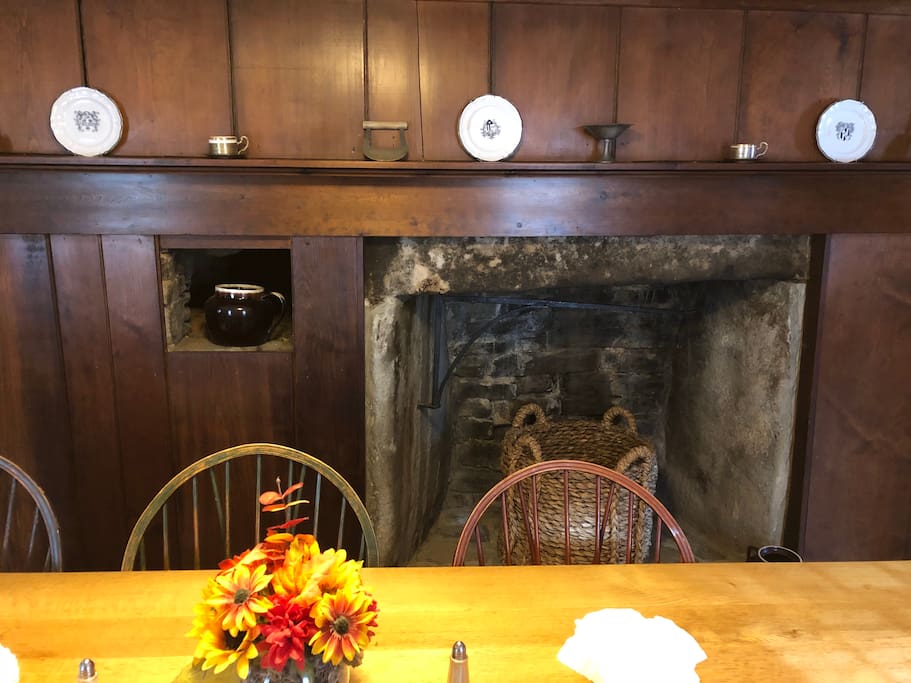 The house is built around this massive chimney, which has paneling decorating portions of it. Fireplaces not functional.