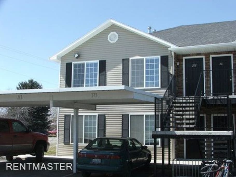 Outside of the apartment. Guests receive one covered parking spot, and additional parking is available with uncovered spots.