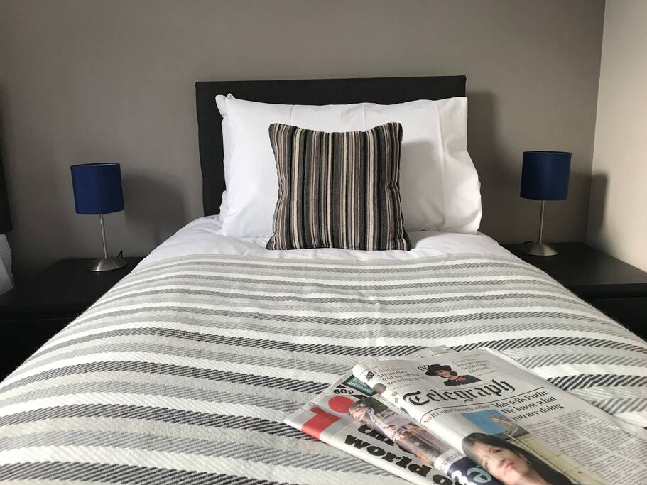 Twin room with fresh, clean linen and towels