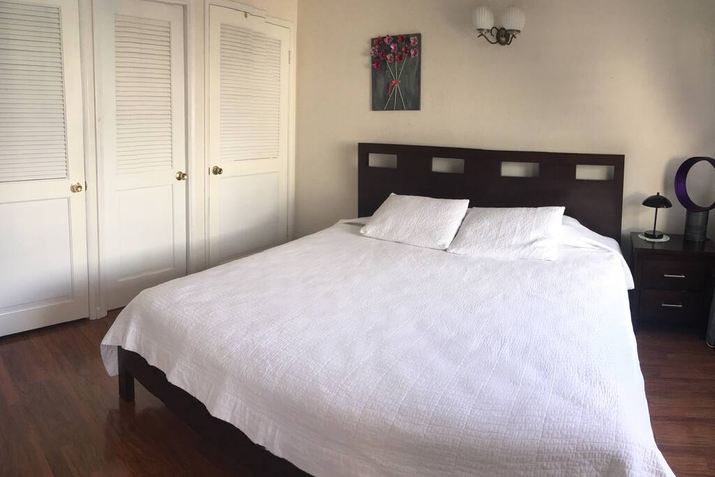 King size bed, covers for the bed are stored for your convenience.