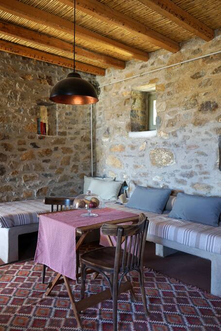 Living room and stone built single beds