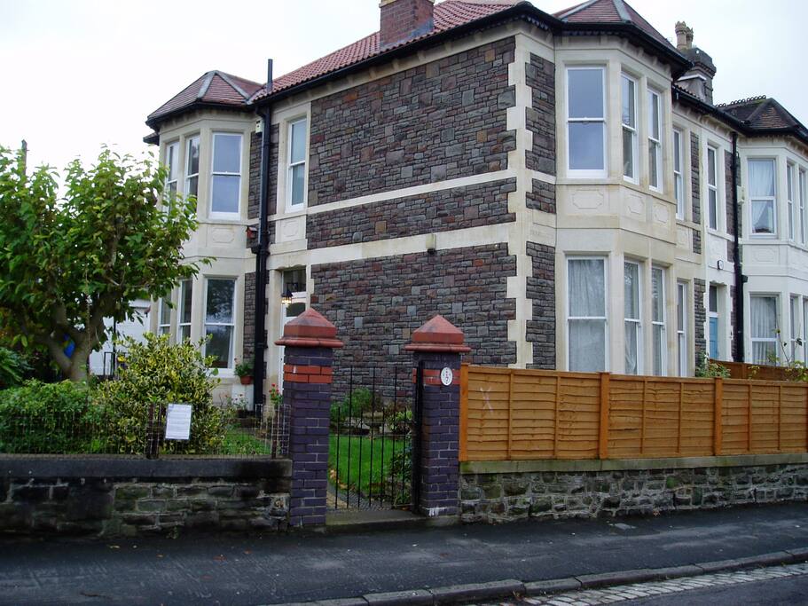 Large Victorian House with well kept garden.