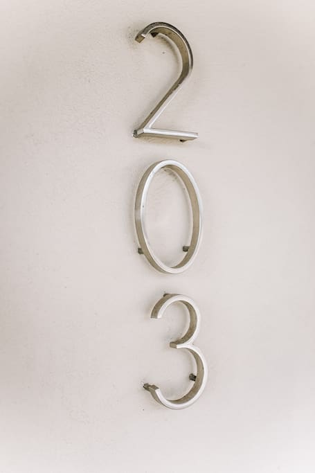 Second floor apartment, number 203.