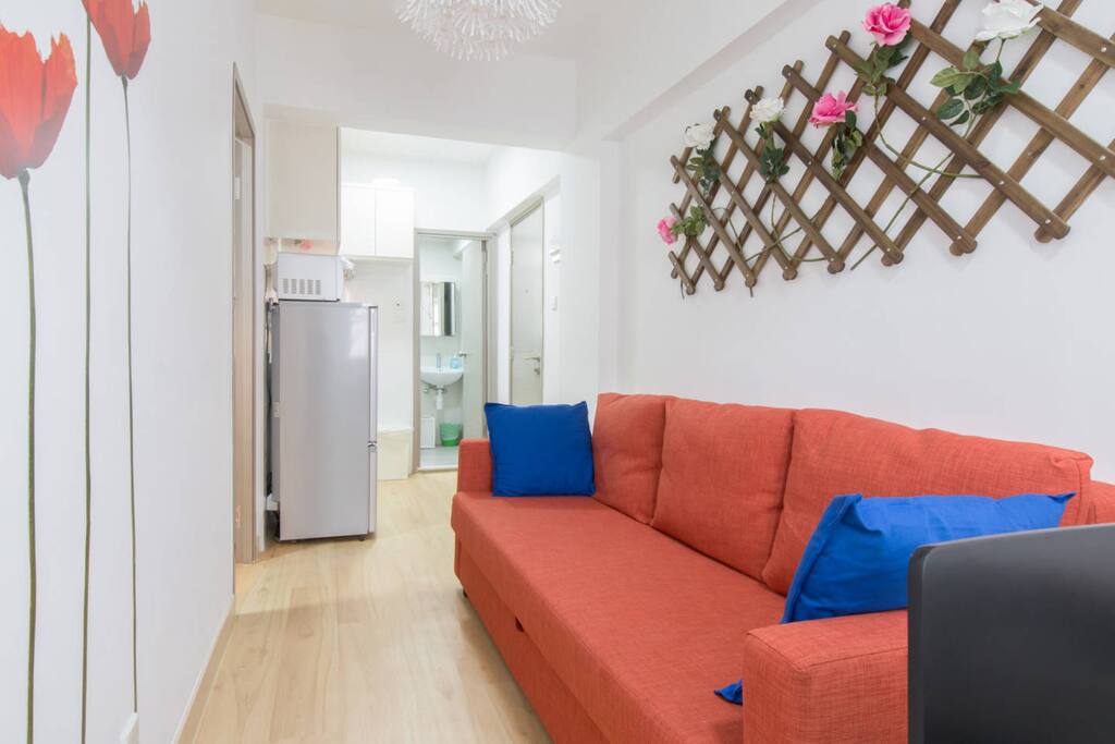 Comfy sofa in living room area and dining area