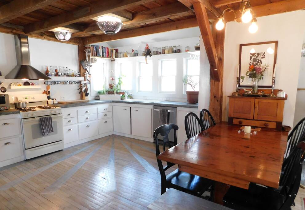 Kitchen overlooking brook. Concrete countertops and lots of work space.