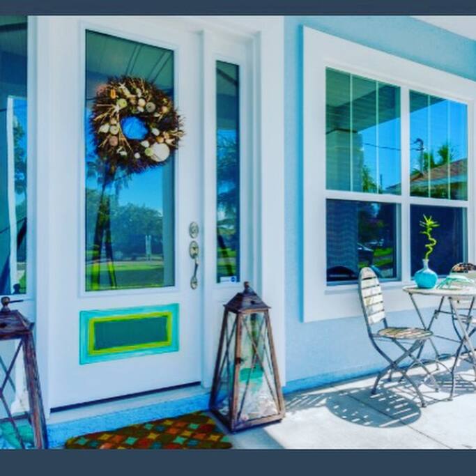 Front porch is a cozy space for socializing, resting, reading or just enjoying the ocean breeze.