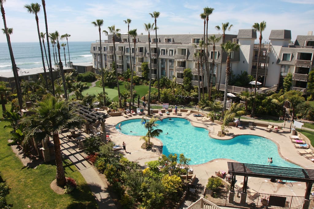 Complex pool and putting green with BBQ areas
