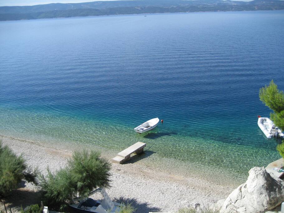 Pebble beach with crystal clear sea