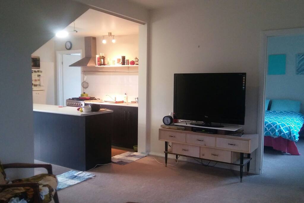 living area and kitchen just off your bedroom