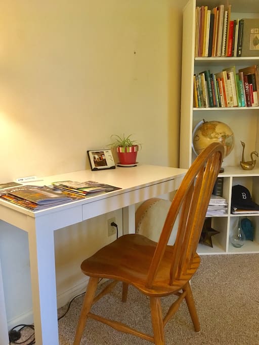 Writing and computer desk, plus pamphlets for Ithaca & the Finger Lakes