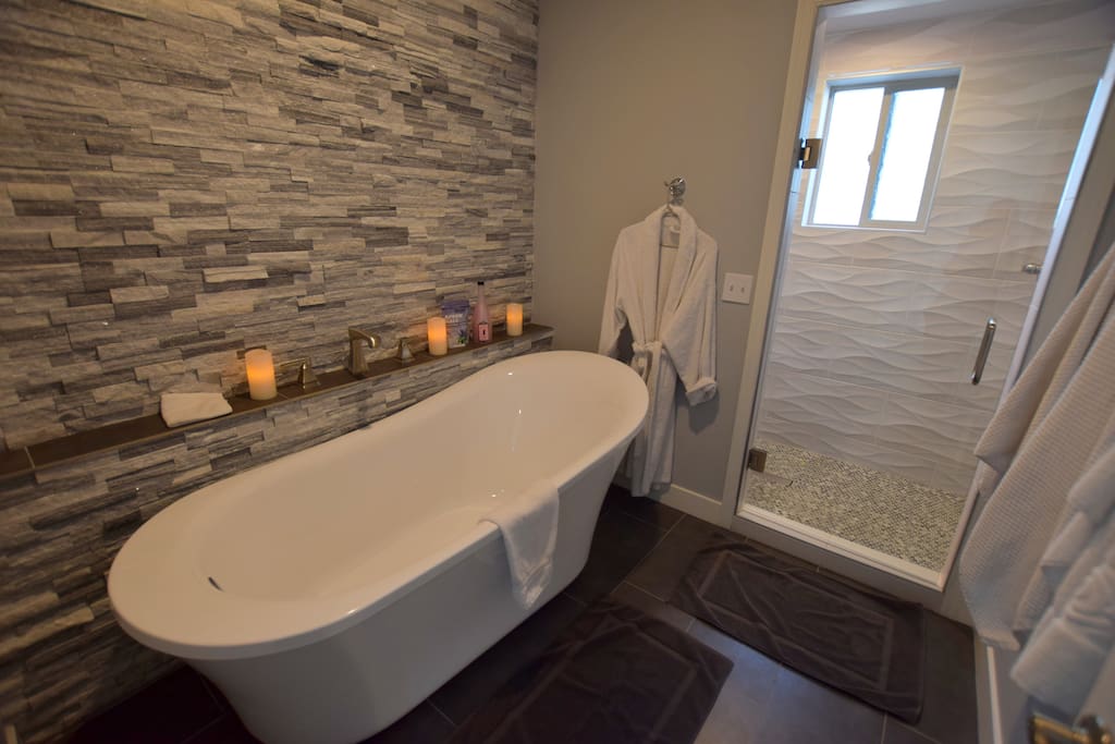 Light the candles and take a bubble bath. We provide shampoo, conditioner, bath wash, bubbles for the bath and towels. Or take a shower with shower head in front and above you. Enjoy the spa!
