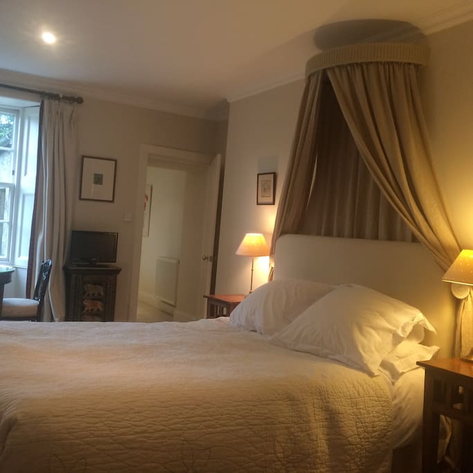 An extra long (7ft) canopied king sized bed
