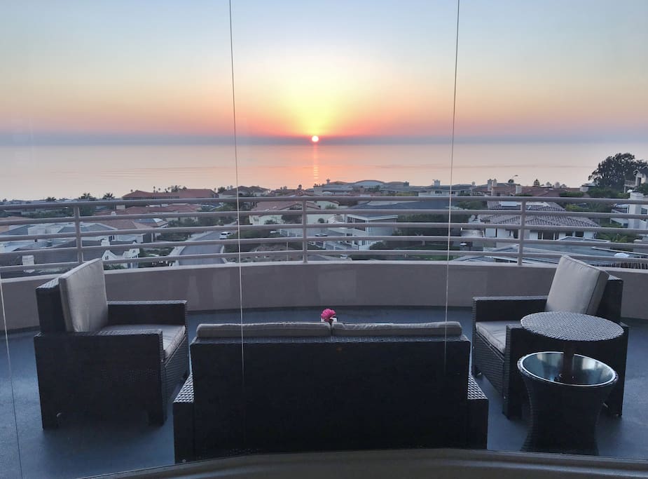 Sunset view from shared front deck.
Guests are welcome to relax in this area and use patio furniture.