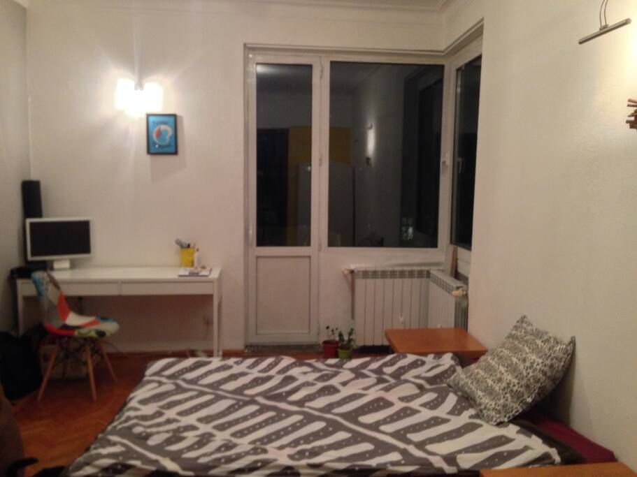 Your room: Bed, desk, balcony.
