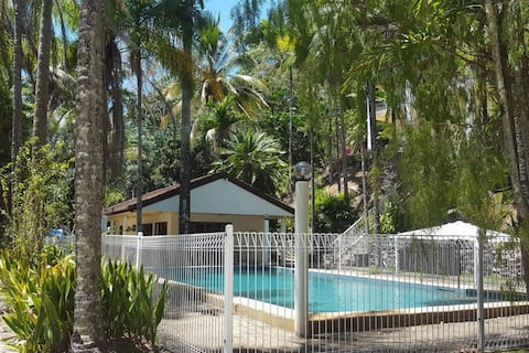poolhouse set in tropical surroundings