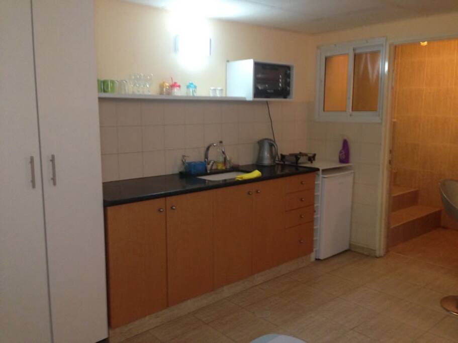 kitchenette view & private entrance to the studio.