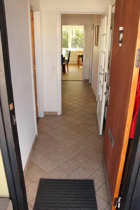 Main entrance to the apartment. (bathroom to the left, bedroom right, kitchen/living room straight ahead)
