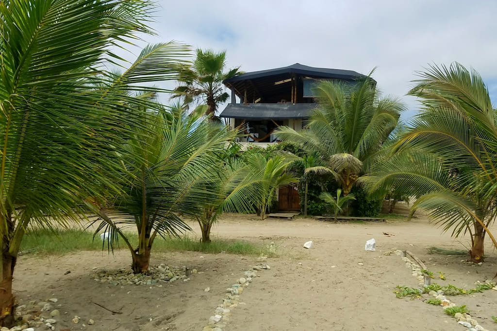 View of La Casa hostel from beach