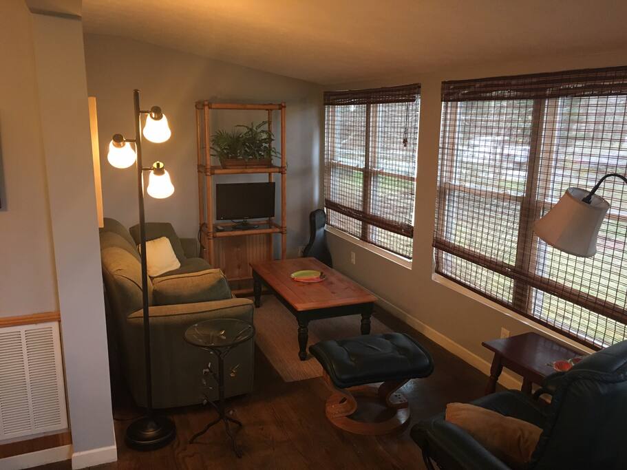 Cozy living room with couch, recliner, cable TV and wifi