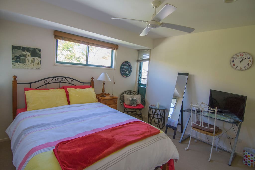 The bedroom has everything you need, TV, table and chair and a mirror