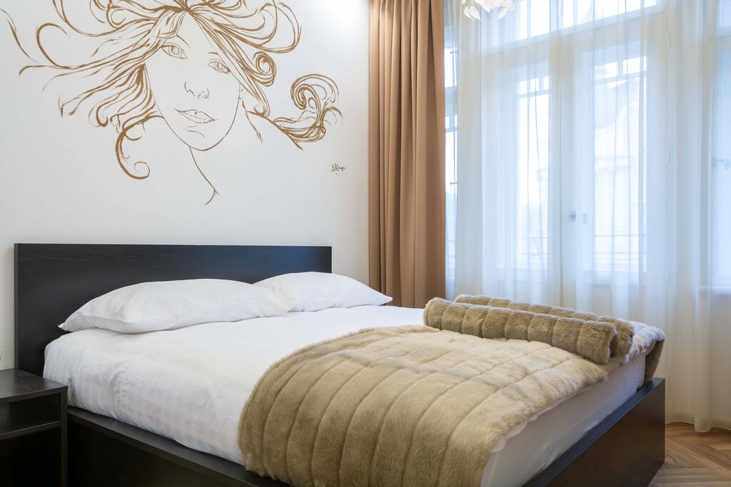 Bedroom with original painting by the apartment's designer