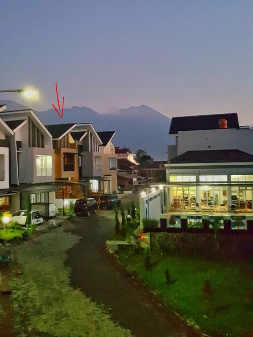 The house with the surrounding mountains.
