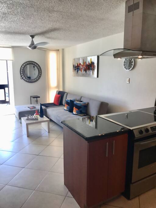 Air- conditioned Living room with big sofa bed, 46 inch Smart TV with surround system!